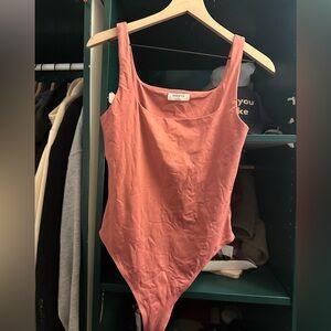 Pink Aritzia bodysuit